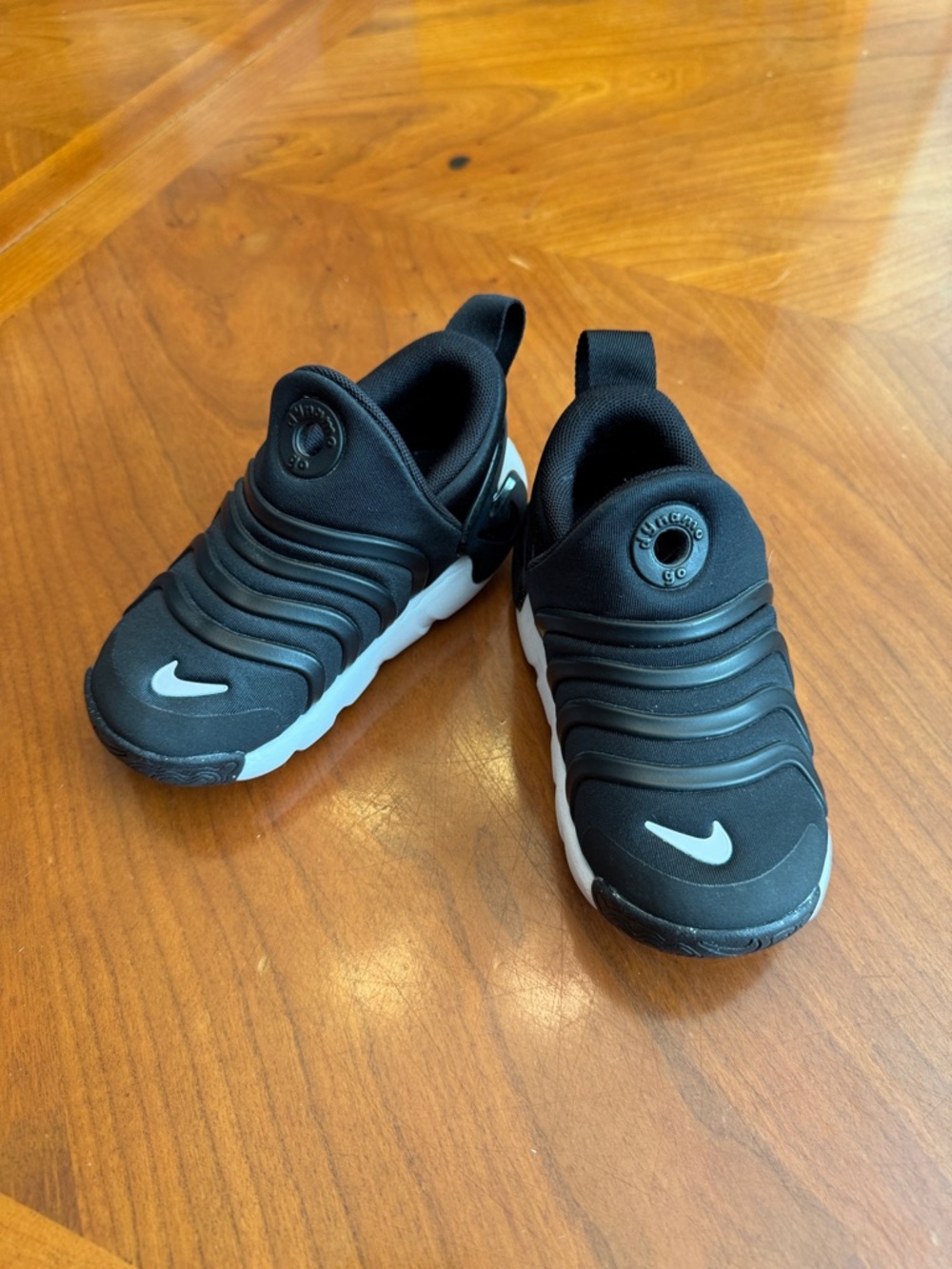Nike Kids Black Slip-On Sneakers with White Swoosh Accent